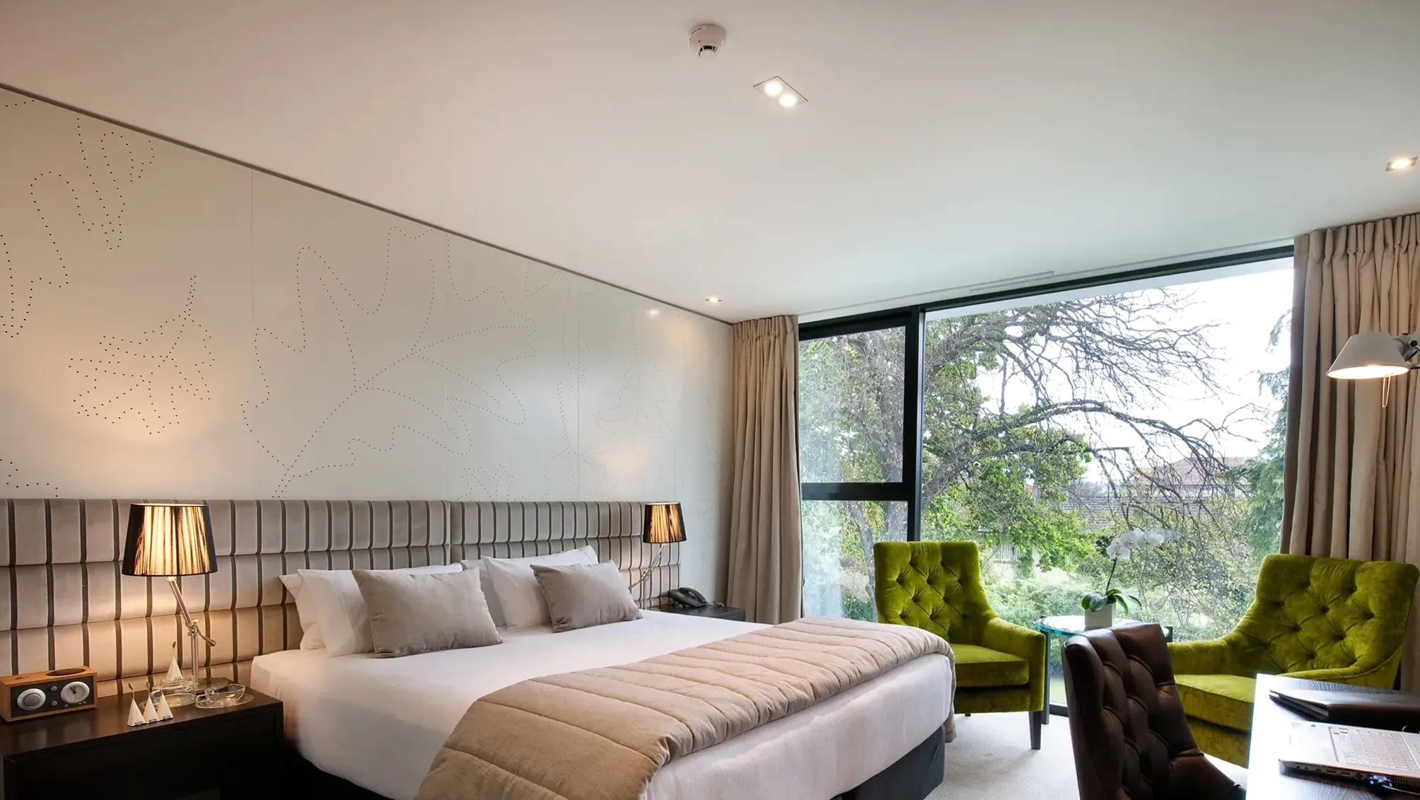 Luxury suite living area with fireplace and lake-facing windows